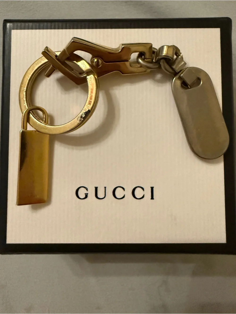 Gucci Plus mixed metal and red enamel keychain